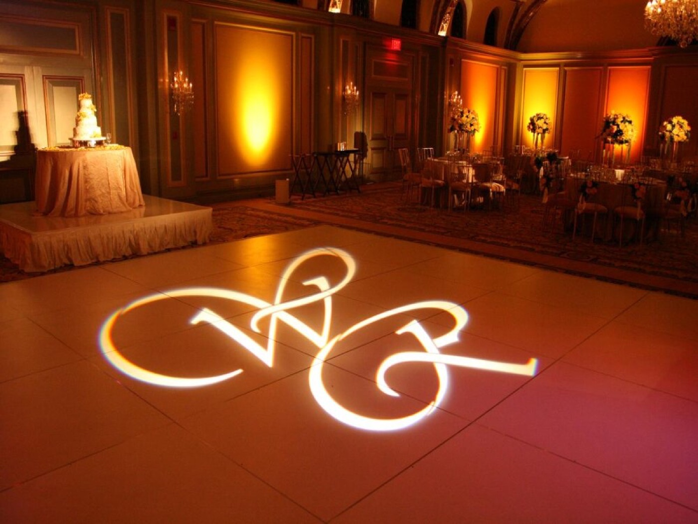 A couple's monogram projected on the dance floor